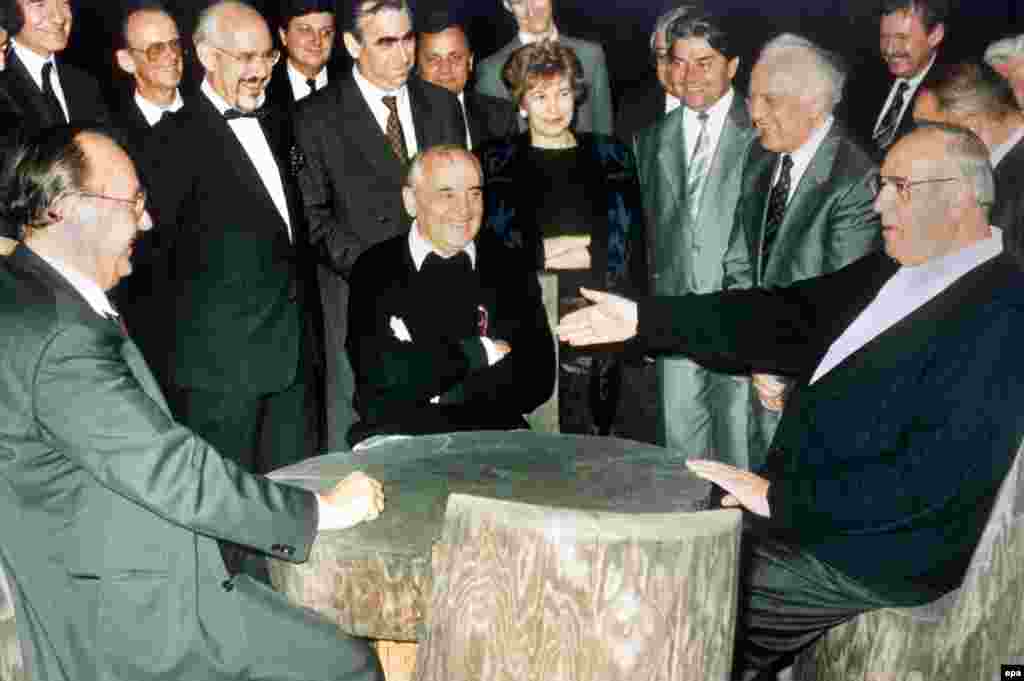 Gorbachev and his foreign minister, Eduard Shevardnadze, meet West German Chancellor Helmut Kohl and Foreign Minister Hans-Dietrich Genscher to discuss the terms of German reunification on July 15, 1990.