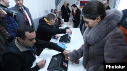 Armenia - Election officials test new electronic machines for voter identification at a polling station in Armavir province, 12Feb2017.