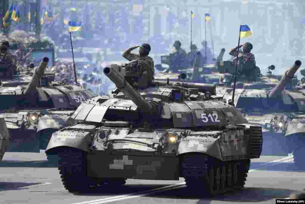 Tanks ride along Khreshchatyk Street during a military parade to celebrate Independence Day in Kyiv.