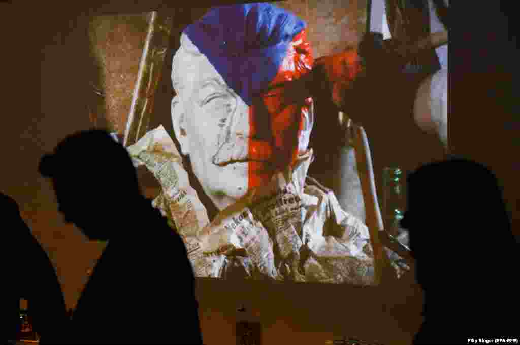 Visitors pass an animation during the press preview of the exhibition Move Little Hands, Move! by Czech surrealists Jan and Eva Svankmajer in Dresden, Germany, on November 18. (epa-EFE/Filip Singer)&nbsp;