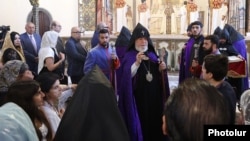 Armenia - Catholicos Garegin II blesses worshippers in the Echmiadzin cathedral of the Armenian Apostolic Church, August 16, 2026.