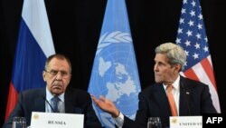 GERMANY -- US Secretary of State John Kerry (R) gestures beside of Russian Foreign Minister Sergei Lavrov (L) during a news conference after the International Syria Support Group (ISSG) meeting in Munich on February 12, 2016. / AFP / Christof STACHE
