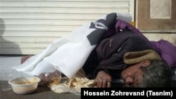 Iran -- An Iranian homeless sleeping outdoor. 