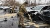 Russian military personnel take part in cleanup operations after what local authorities called a Ukrainian missile attack in Belgorod on March 17. 