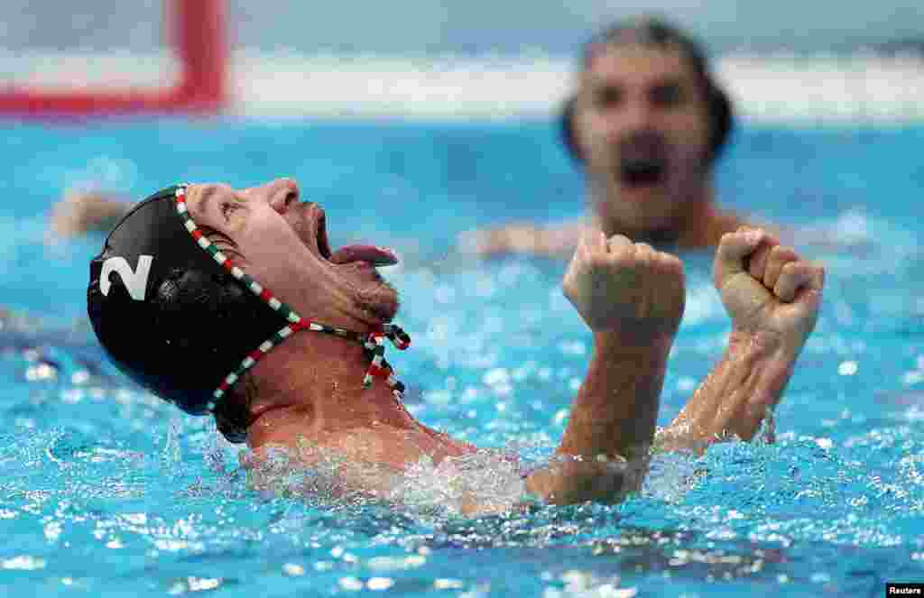 Hungary's Daniel Angyal celebrates after his country won a water polo match against Serbia at the World Aquatics Championships in Singapore.