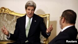 Egyptian President Muhammad Morsi (right) meets with U.S. Secretary of State John Kerry in Cairo in March.