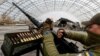 A member of Ukraine's mobile air-defense group checks a M2 Browning machine gun in the town of Hostomel, Ukraine, on April 1. 