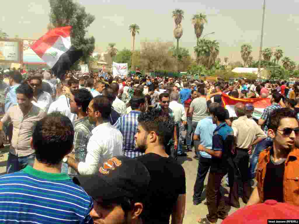 Demonstrators rally against high pensions and benefits for Iraqi parliament members in Baghdad on August 31.