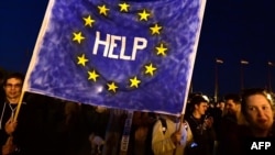Protesters in Budapest take part in a demonstration against a new higher education law that could shut down a university in the Hungarian capital linked to the billionaire philanthropist George Soros.