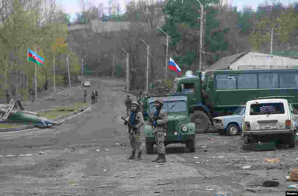 Azerbaijani soldiers guard a checkpoint on the outskirts of Shushi/Susa on November 13.&nbsp;