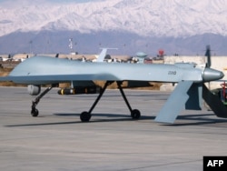 A U.S. Predator unmanned drone leaves its hangar at Bagram air base in Afghanistan in 2009.