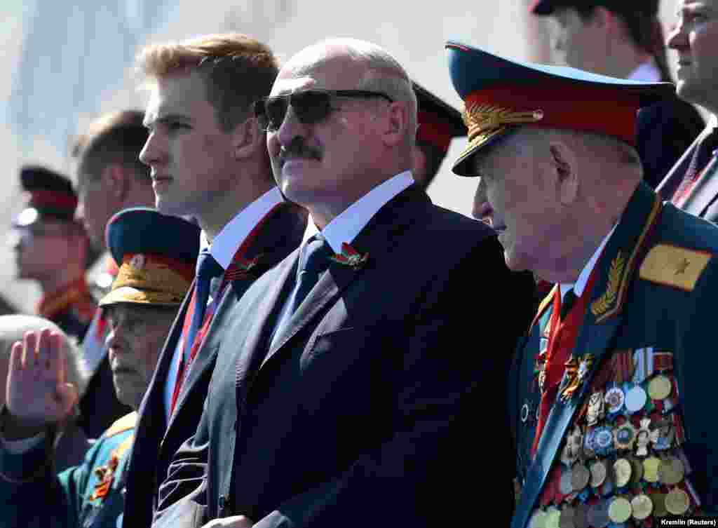 Belarusian President Alyaksandr Lukashenka and his son, Mikalay, attend the Moscow Victory Day Parade on June 24.&nbsp;