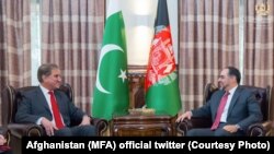 Afghan Foreign Minister Salahuddin Rabbani (R) met his Pakistani counterpart Shah Mehmood Qureshi in Kabul on December 24.