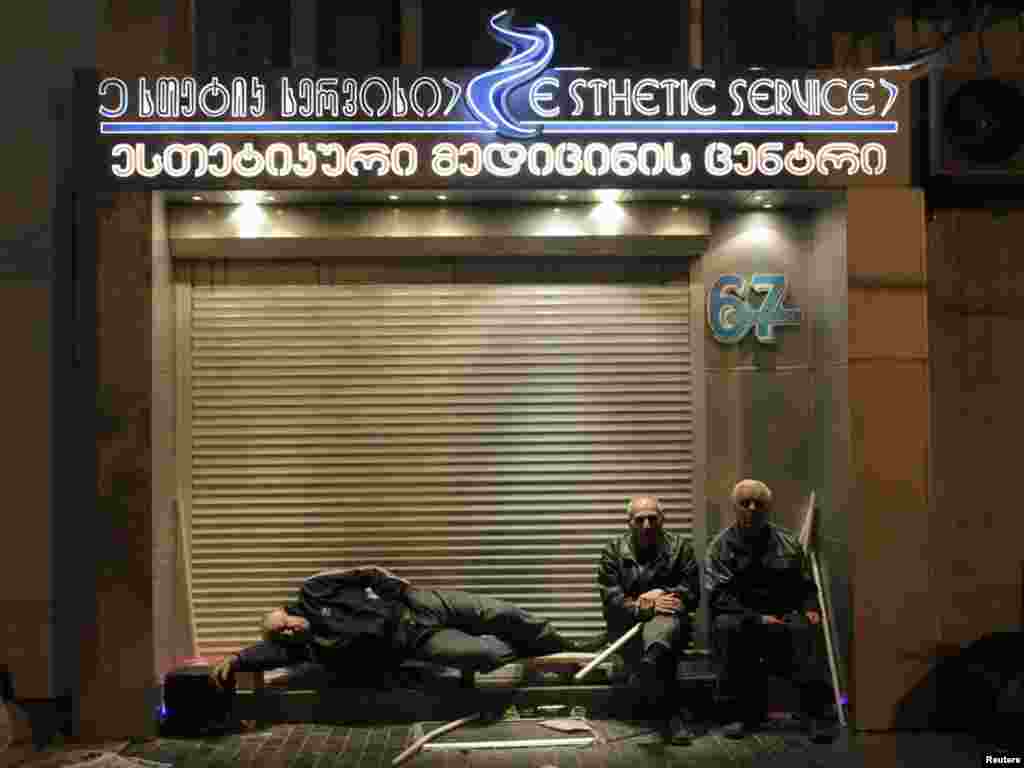 Georgia -- Activists rest during an overnight opposition rally in Tbilisi, 23May2011 - Activists rest during an overnight opposition rally in Tbilisi, May 23, 2011. REUTERS/David Mdzinarishvili (GEORGIA - Tags: POLITICS CIVIL UNREST)