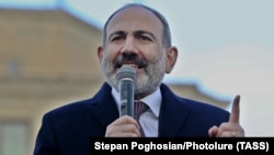 Armenian Prime Minister Nikol Pashinian addresses his supporters during a gathering on Republic Square in Yerevan on February 25.