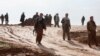 Kurdish Peshmerga fighters during a battle against Islamic State militants on the outskirts of Mosul on January 21.