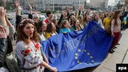 Ukrainian students form a live chain during a performance named "Ukraine and Europe are strong together!" in downtown Kyiv on April 5.