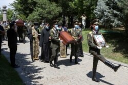 Armenian soldiers take part in the funeral in Yerevan on July 16 of Mayor Garush Hambardzumian, who was killed during clashes in the Tavush region.