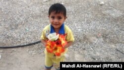 Iraq - A child with flower from Naseriya, August 2011