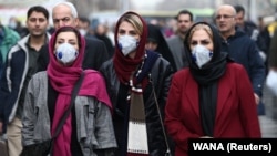 Iranian women wear protective masks in Tehran's Grand Bazaar after five cases of the coronavirus were confirmed in the country on February 20.