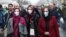 Iran -- Iranian women wearing protective masks to prevent contracting a coronavirus walk at Grand Bazaar in Tehran, February 20, 2020