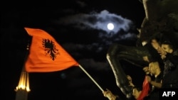 Albanian activists celebrate in Tirana's main square on November 15 at the announcement by Prime Minister Edi Rama that he turned down a request by the United States to be part of an operation to destroy Syria's chemical-weapons stockpile.