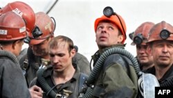 Rescuers search for miners after the May accident