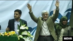 Mohammad Reza Aref (center) and his wife during campaigning