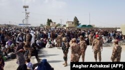 Afghan nationals waiting to cross the border at Chaman-Spin Boldak into Pakistan earlier during lockdown. Pakistani security officials said a July 31 protest against the closure of the border turned violent.