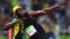 Usain Bolt of Jamaica celebrates after placing first in the men&#39;s 100-meter race, making him the first person to win three consecutive Olympic gold medals in that event. The sprinter clocked 9.81 seconds in the final in Rio on August 14.&nbsp;