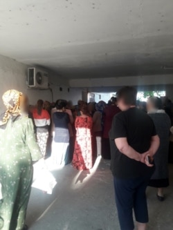 Lines for food outside a grocery store in Ashgabat.