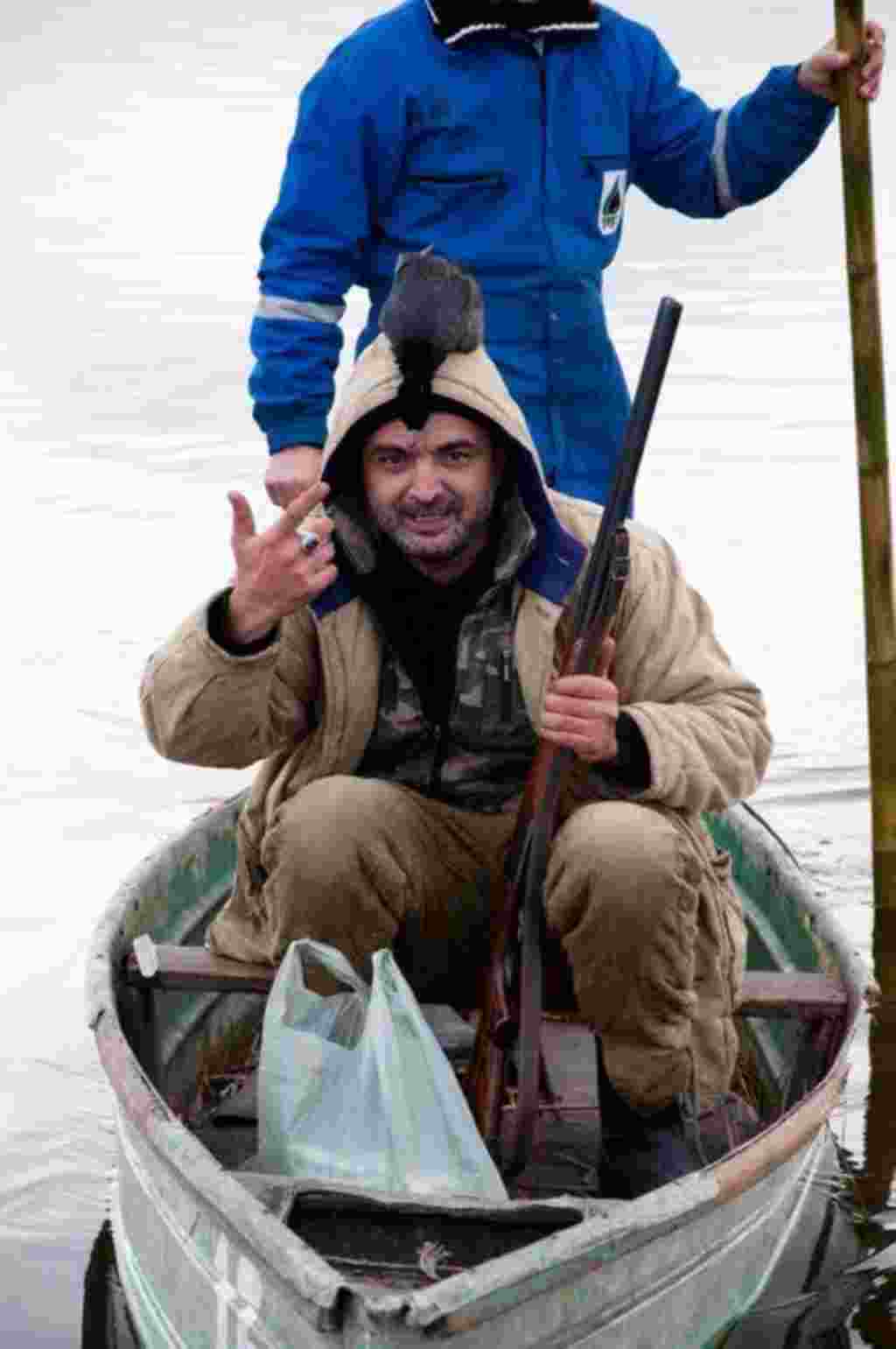 A hunter proudly wears the day's catch.