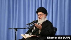 Iranian Supreme Leader Ayatollah Ali Khamenei is seen on stage during a religious lecture in Tehran, February 23, 2020