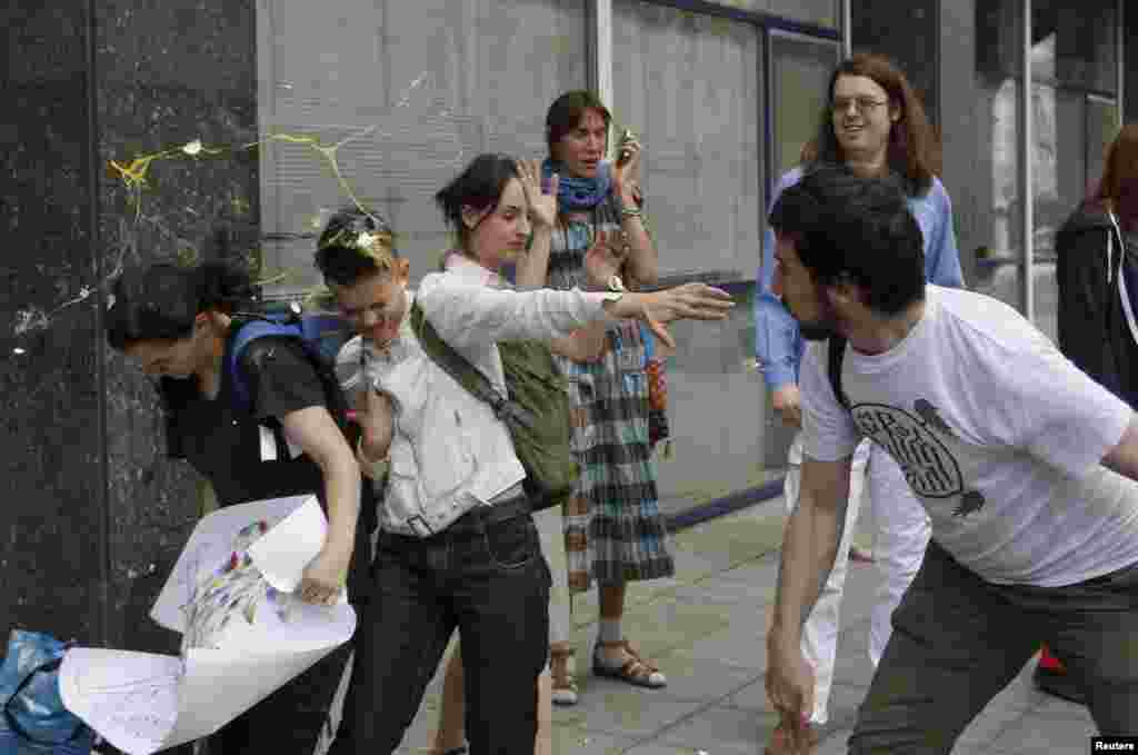 An egg splatters over young gay-rights activists after an attempted &quot;kiss-in&quot; in front of the Russian parliament in Moscow in 2013. Vladimir Putin himself has maintained a publicly benign attitude to Russia&#39;s LGBT community and has repeatedly claimed Russia does not discriminate against gays.&nbsp;