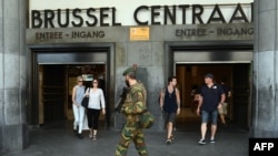 A Belgian soldier patrols around the Central train station in Brussels on June 21.