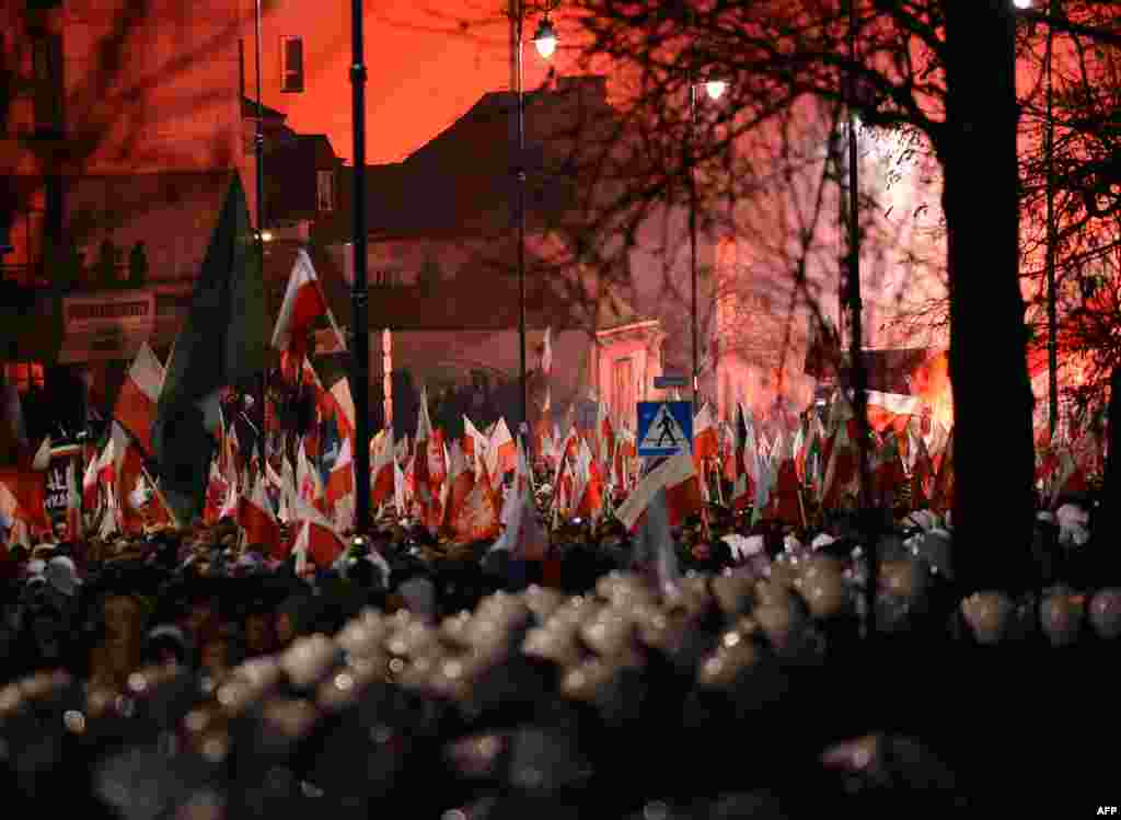 Far-right protesters walk past the Russian Embassy during their annual march, which coincides with Poland's national Independence Day in Warsaw. (AFP/Janek Skarzynski)