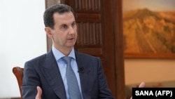 SYRIA -- Syrian President Bashar al-Assad speaking during an interview with Russia Today in Damascus, March 5, 2020