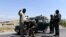 Afghan security officials frisk a man on a roadside as security has been high intensified after Taliban announced the start of their annual spring offensive, in Jalalabad, on April 28.
