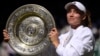 Kazakhstan's Elena Rybakina poses with the trophy after winning the women's singles final against Tunisia's Ons Jabeur on July 9.