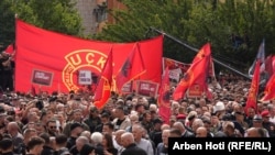 Protesters with KLA flags (carrying the Albanian-language acronym UCK) in Pristina on September 12.