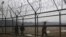 South Korean soldiers patrol along a barbed-wire fence, near the demilitarized zone that separates the two Koreas in Paju, north of Seoul.