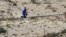 U.S. - Daredevil Nik Wallenda gives a thumbs-up sign as he nears the end, after walking on a 5-cm diameter steel cable rigged 426.7 metres across more than a quarter-mile deep remote section of the Grand Canyon near Little Colorado River, 23Jun2013. 
