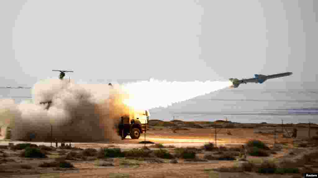 A long-range shore-to-sea missile is launched during Iran&#39;s Velayat-90 war game on the Sea of Oman coast near the Strait of Hormuz. REUTERS/Jamejamonline/Ebrahim Norouzi/Handout