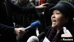 President Islam Karimov's iron grip on the country has forced many critics of his administration, including Mutabar Tajibaeva, seen here protesting in front of the European Commission in Brussels in January, to voice their grievances abroad or not at all.