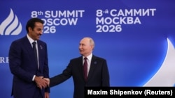 Russian President Vladimir Putin shakes hands with Qatar's Emir Tamim bin Hamad bin Khalifa Al Thani during the Summit of Heads of State and Government of the Gas Exporting Countries Forum (GECF) in Moscow on October 27, 2026.