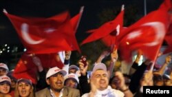 Supporters of the ruling Justice and Development Party cheer in front of party headquarters in Istanbul on September 12.