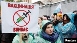 People attend a rally against coronavirus restrictions in Kyiv on November 3.