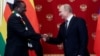 Moscow, Russia - Russia's President Vladimir Putin and imbabwean counterpart Emmerson Mnangagwa / Russia's President Vladimir Putin (R) shakes hands with his Zimbabwean counterpart Emmerson Mnangagwa during a signing ceremony at the Kremlin in Moscow, Rus