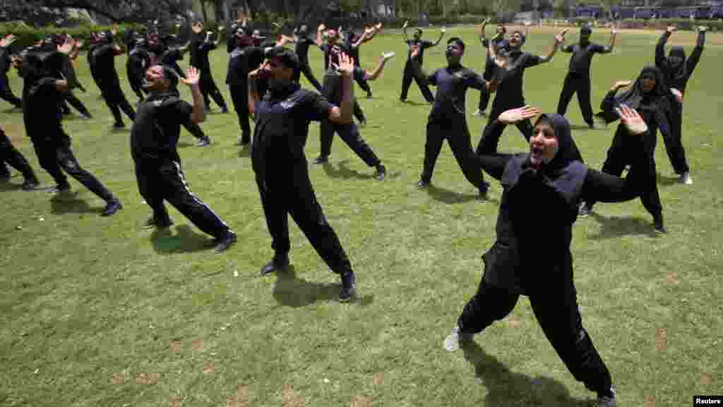 Members of the Pakistani police commando take part in an exercise session at police lines in Lahore. (Reuters/Mohsin Raza)