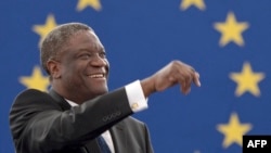 France -- Congolese gynaecologist, specialised in treating victims of rape and extreme sexual violence, Denis Mukwege reacts after receiving the prestigious Sakharov human rights prize at the European Parliament in Strasbourg, November 26, 2014 